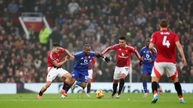 Manuel Ugarte, Jordan Ayew and Casemiro compete for the ball