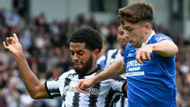 St Mirren's Miguel Freckleton and Rangers' Mikey Moore