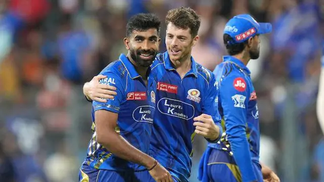 Jasprit Bumrah and Mitchell Santner celebrate a wicket for Mumbai Indians