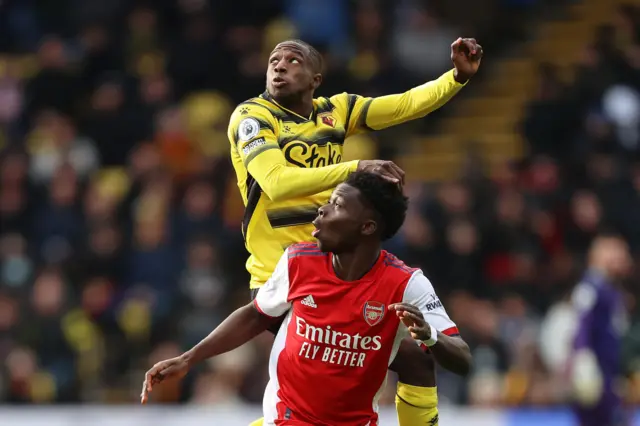 Hassane Kamara and Bukayo Saka battle for the ball