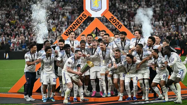 John McGinn about to lift Europa League trophy with squad