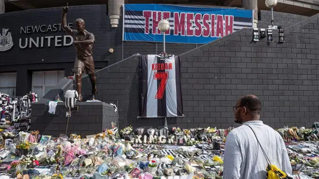 Tributes are laid outside St James Park