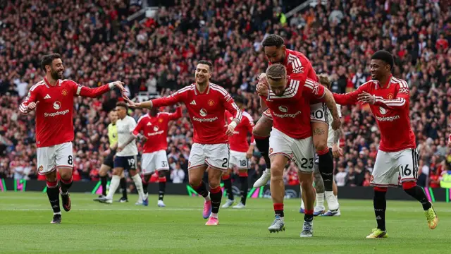 Manchester United players celebrate a goal