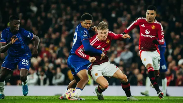 Rasmus Hojlund of Manchester United and Chelsea's Wesley Fofana battle for possession