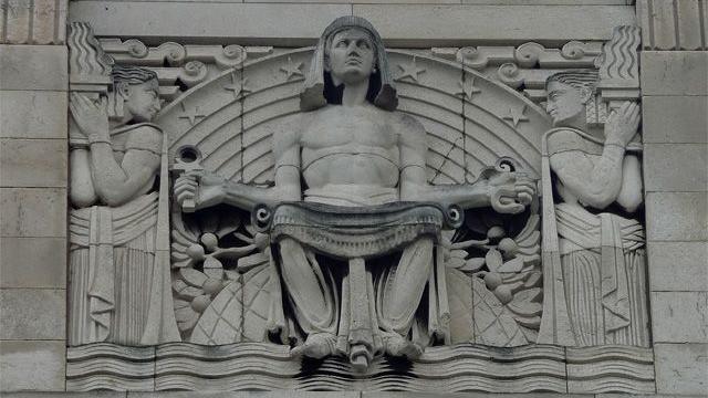 An ornate carving above Sheffield Central Library shows an Egyptian figure called Knowledge holding an ankh in one hand and an asp in the other, representing the choice between good and evil.