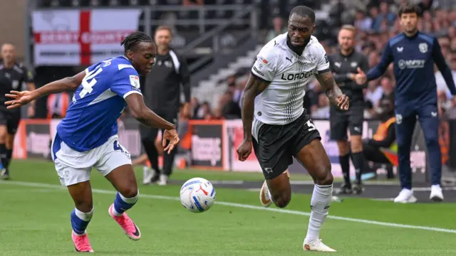 Cardiff City's Ronan Kpakio (left) and Derby County's Corey Blackett-Taylor battle for the ball at Pride Park