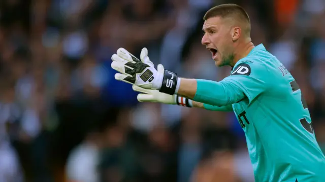 Sam Johnstone gestures to his defenders