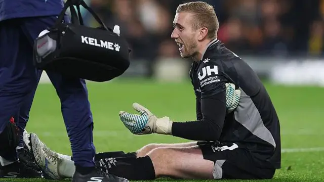 Egil Selvik winces in pain during the Watford's match with Bristol City
