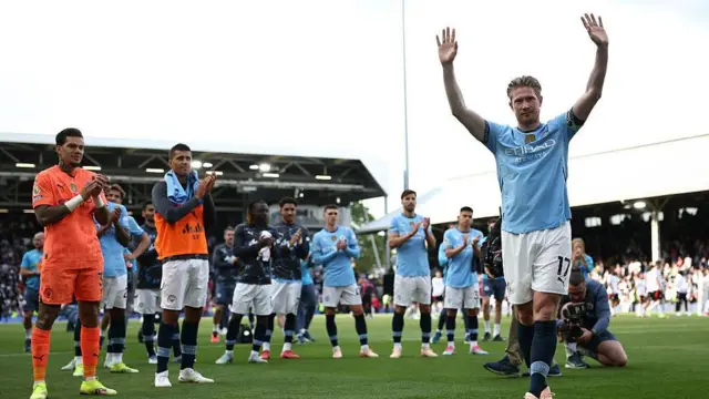 Kevin de Bruyne acknowledges the fans after his final game