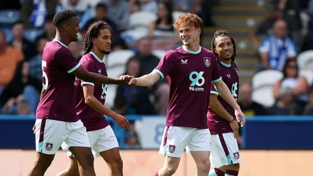 Tommy McDermott of Burnley celebrates scoring