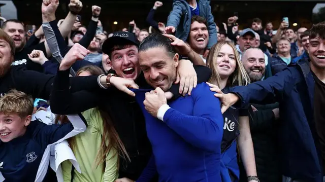 Jack Grealish celebrating with Everton supporters