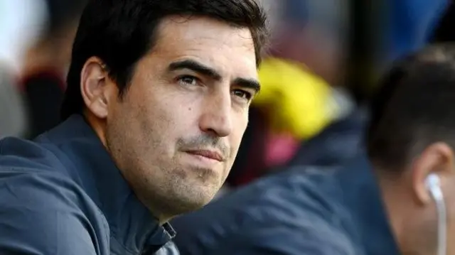 Andoni Iraola sits in the dugout