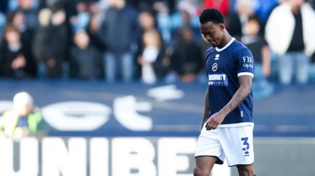 Zak Sturge walks off disconsolately after being sent off against Blackburn