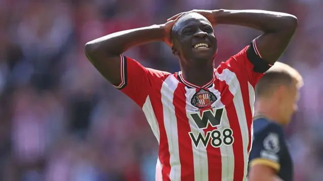 Habib Diarra with his hands on his head