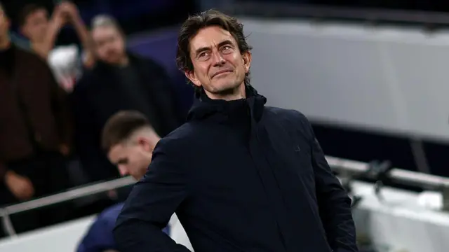 Thomas Frank smiling on the touchline