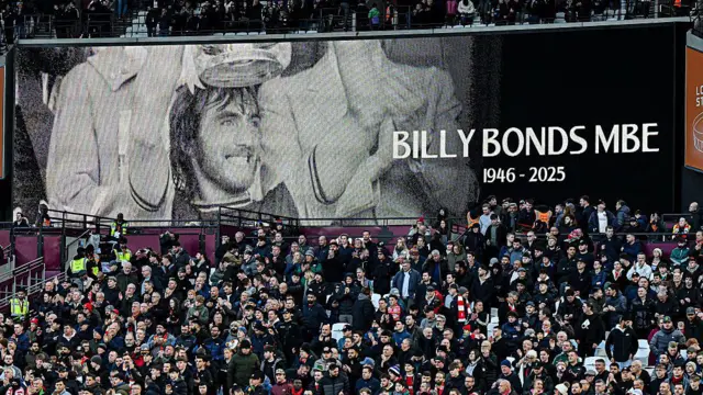 Tribute is paid to Billy Bonds prior to kick-off during the Premier League match between West Ham United and Liverpool under a Billy Bonds MBE tribute banner reading 'Billy Bonds MBE 1946-2025)