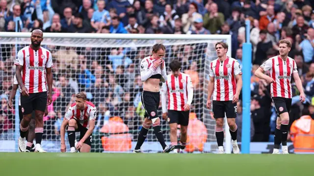 Dejected players of Brentford.