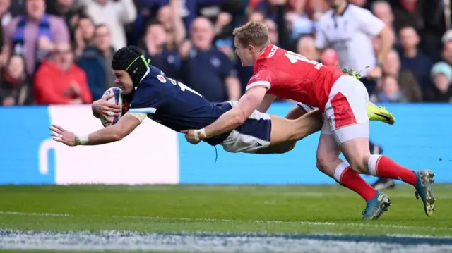Darcy Graham diving over for a try against Wales
