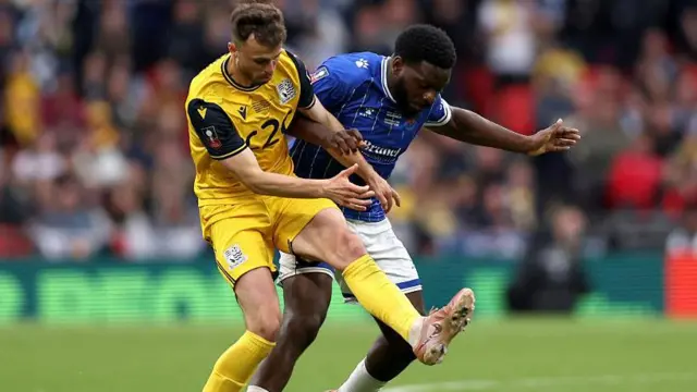 James Morton tangles with Wealdstone's Nathan Tshikuna during Southend's FA Trophy win at Wembley on Sunday.