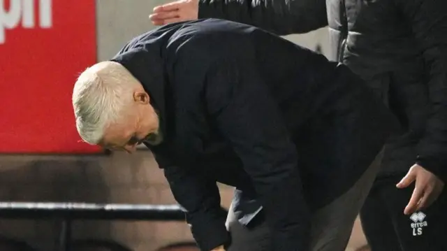 Jim Goodwin puts his hands on his knees