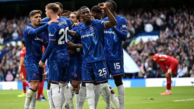 Chelsea players celebrate after scoring against Liverpool 