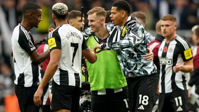 Newcastle players celebrate their victory over Arsenal