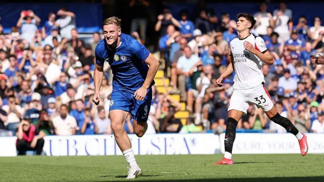 Liam Delap of Chelsea celebrates scoring his team's third goal from the penalty spot