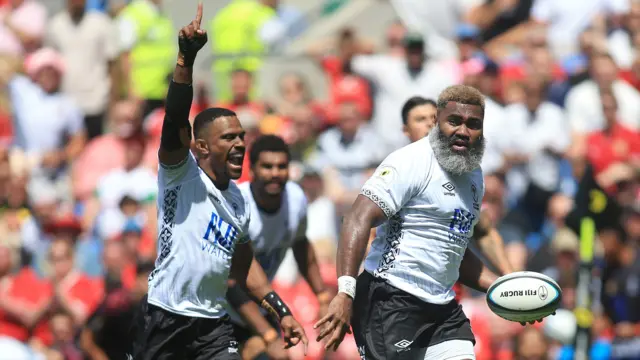 Fiji players playing against Wales