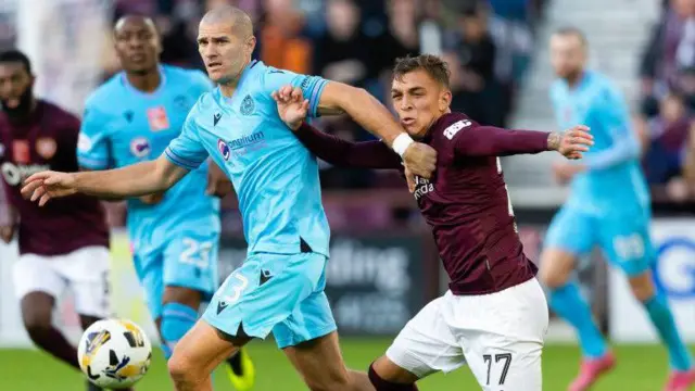 St Mirren's Alex Gogic and Hearts' Kenneth Vargas in action