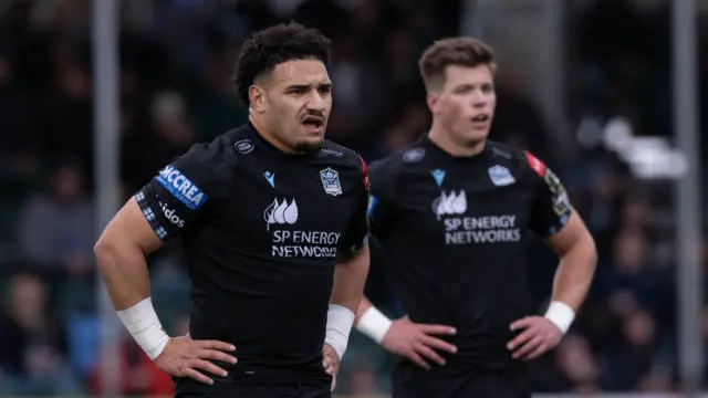 Sione Tuipulotu and Huw Jones in action