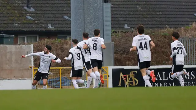 Danny Amos celebrates his goal