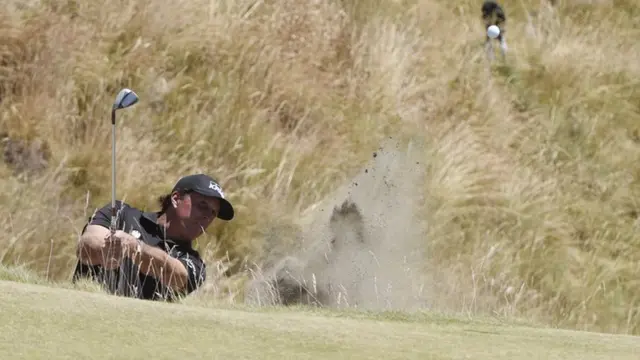 Phil Mickelson hits out of the bunker