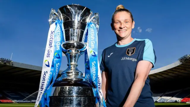 Glasgow City head coach Leanne Ross poses with the trophy at Hampden