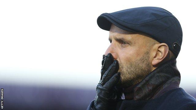 Paul Tisdale looks on as his MK Dons side are defeated by his former club Exeter City