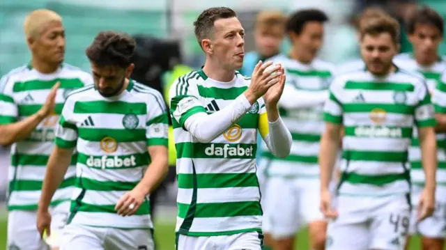 Callum McGregor leads an applause at Celtic Park