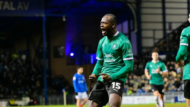 Plymouth forward Mustapha Bundu celebrates a goal.