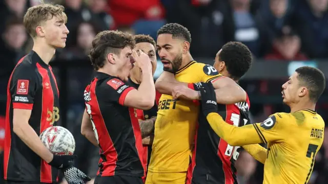 Matheus Cunha of Wolverhampton Wanderers squares up to Bournemouth's Milos Kerkez during an argument