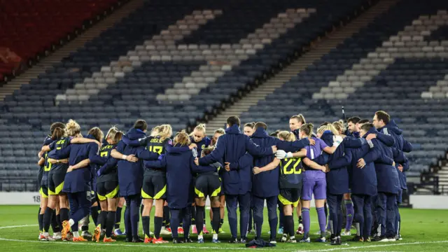 Scotland players and staff gather together after win over Slovakia