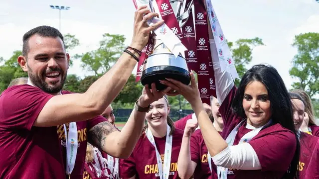 Hearts coach Paschalis Xanthos and head coach Eva Olid with the SWPL trophy