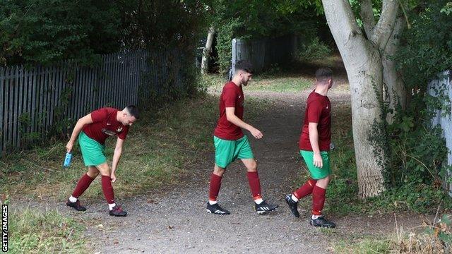 Players from Holyport make their way out for the second half of the first qualifying round tie against Binfield on 4 September