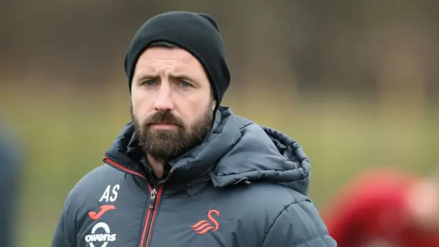 Swansea City coach Alan Sheehan looks on during training