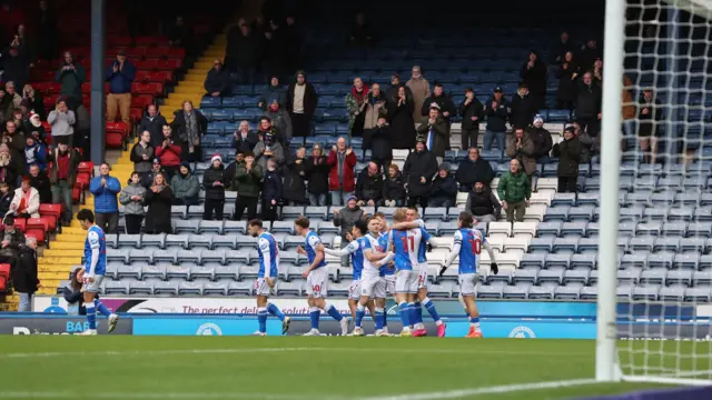 Blackburn Rovers celebrate a goal in front of their fans