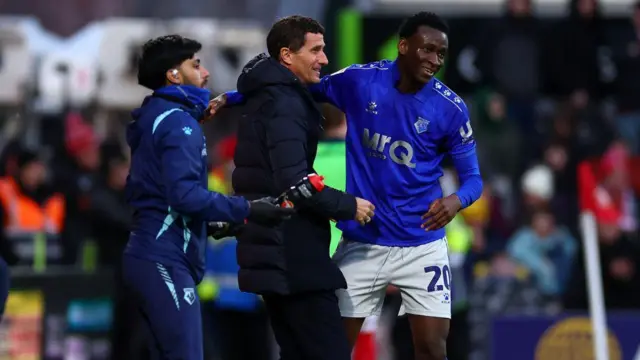 Watford player Mamadou Doumbia celebrating with manager Javi Gracia away at Wrexham