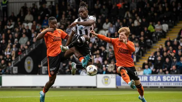 St Mirren's Toyosi Olusanya and Dundee United's Emmanuel Adegboyega and Luca Stephenson in action during a William Hill Championship match between St Mirren and Dundee United at the SMiSA Stadium