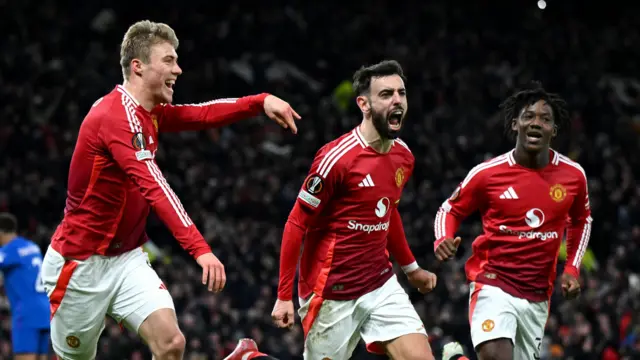 Manchester United players celebrate goal