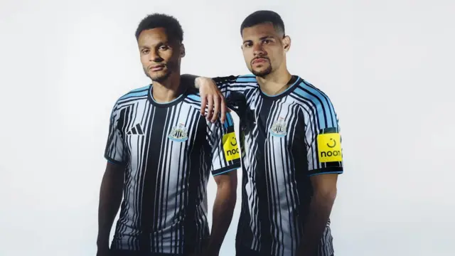 Newcastle United players Jacob Murphy and Bruno Guimaraes model the new home kit.