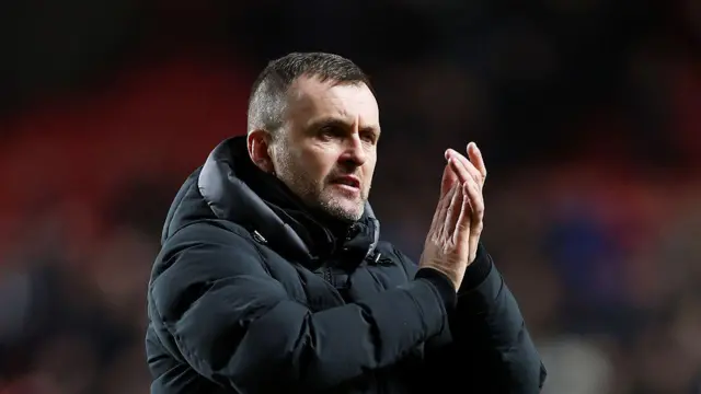Charlton manager Nathan Jones applauds home fans after a draw in the Championship match between Charlton and QPR at The Valley in February 