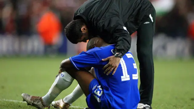 Chelsea's William Gallas sits dejected on the turf at Anfield