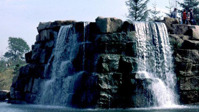 Waterfall feature over rock structure