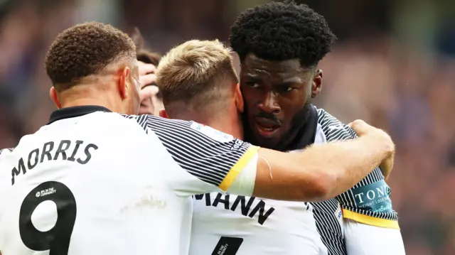 Derby players celebrate a goal